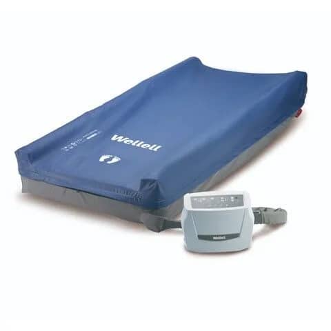 Blue Wellell alternating pressure mattress with control unit attached.