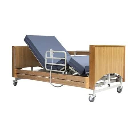 Adjustable hospital bed with wooden frame, blue mattress, side rails, and wheels.