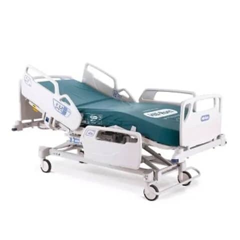 A hospital bed with adjustable height and side rails, featuring wheels for mobility and a green mattress.