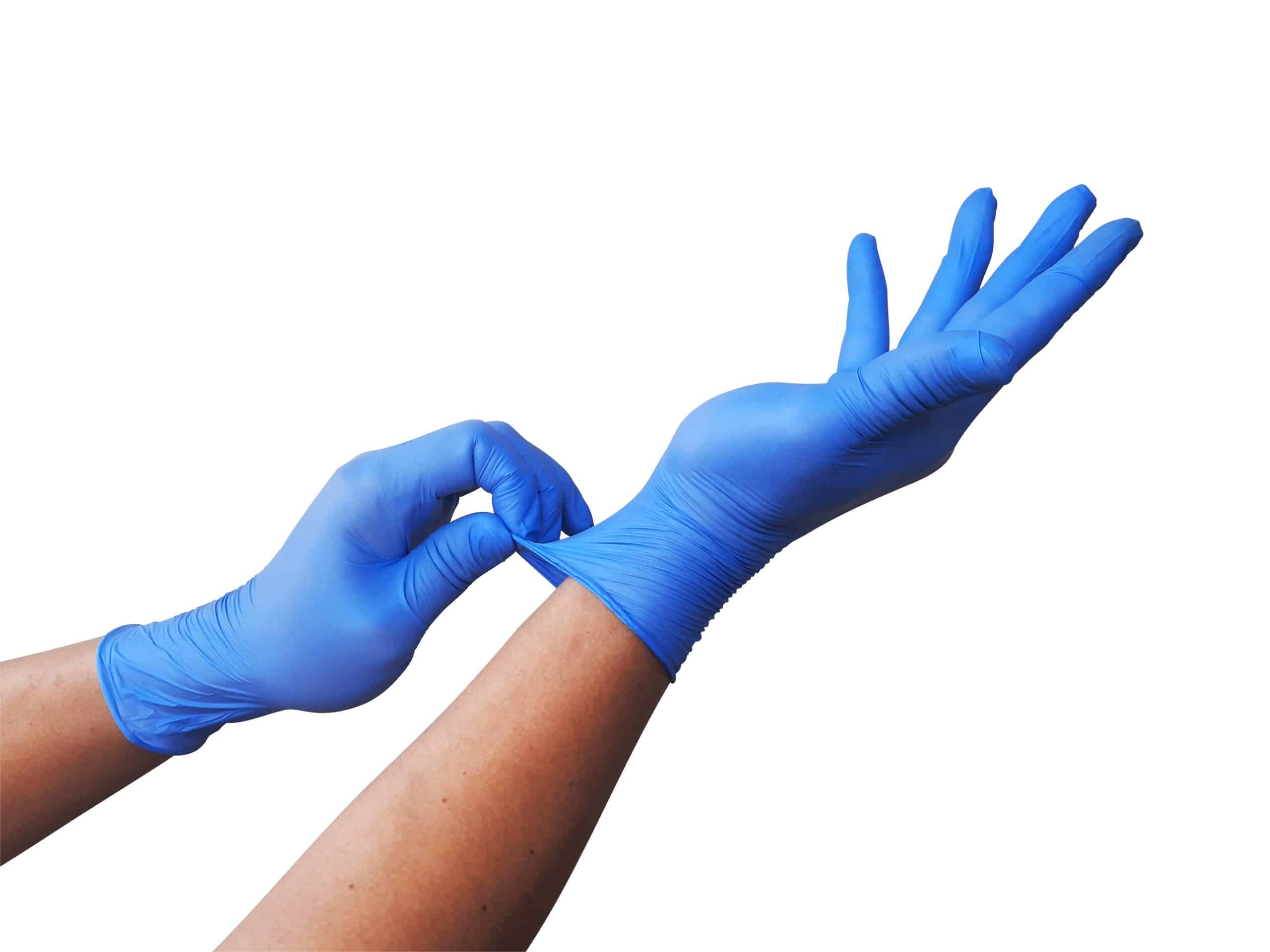 Hands wearing disposable blue nitrile gloves for comparison of vinyl vs nitrile