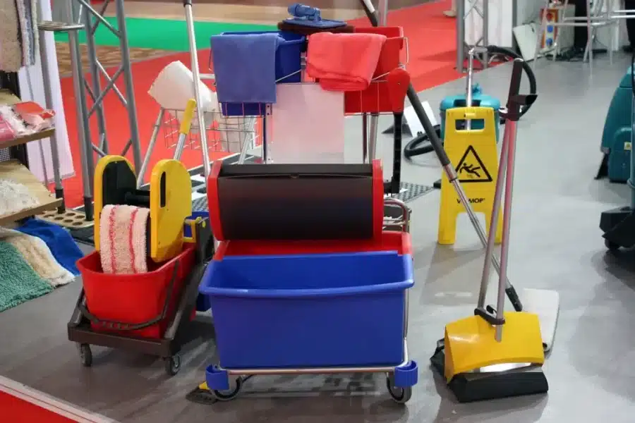Colour coded cleaning storage system with carts, buckets, cloths and equipment