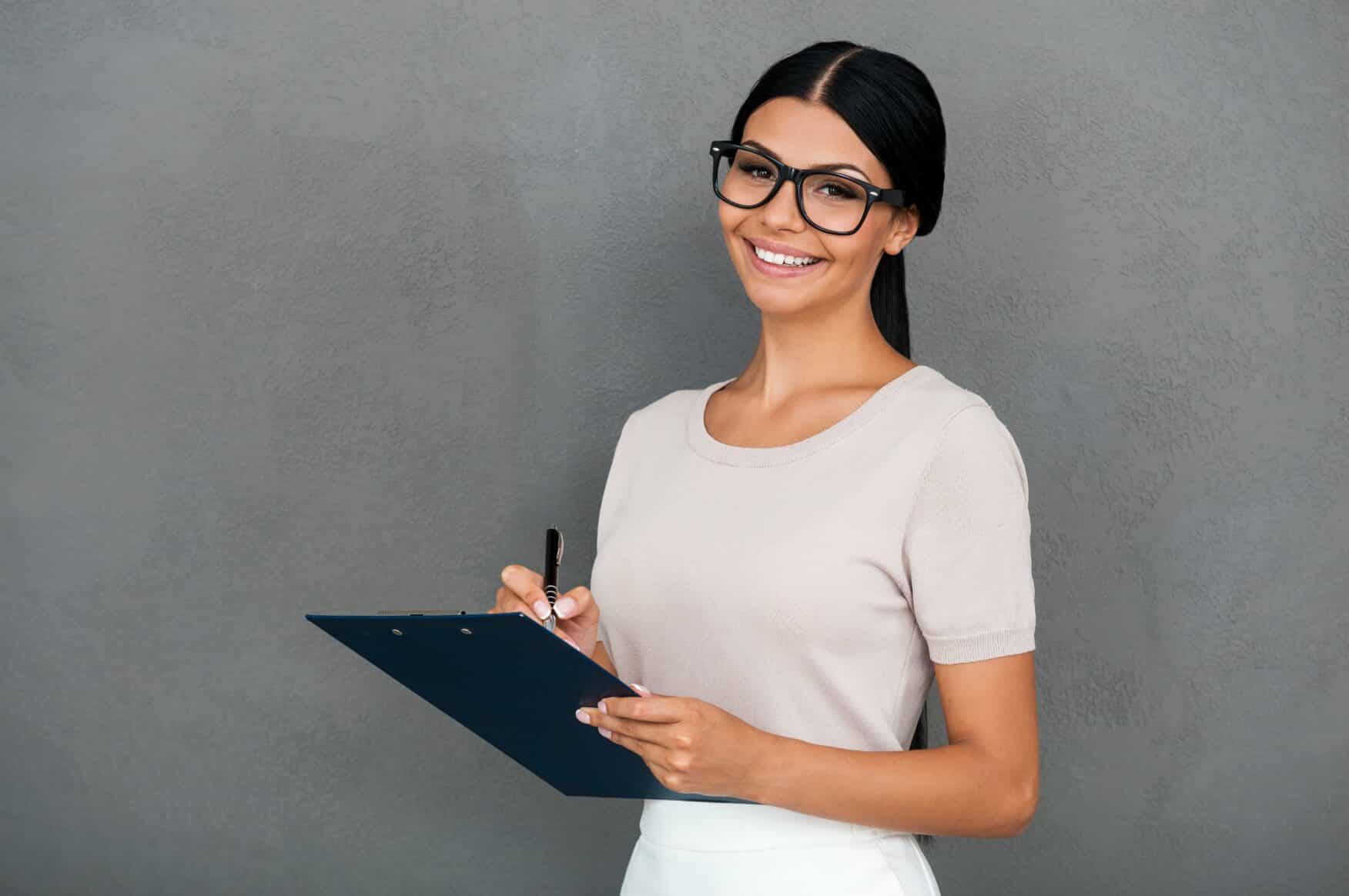 CQC care home inspection – professional woman holding a clipboard for assessment