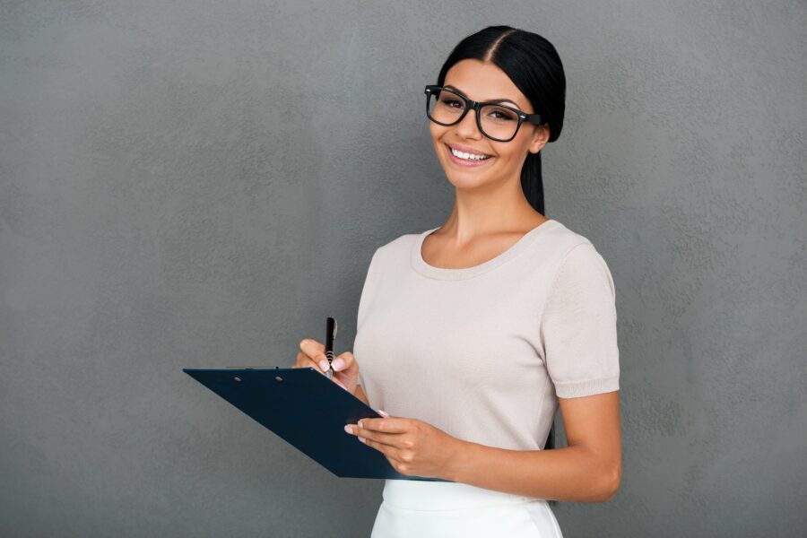 CQC care home inspection – professional woman holding a clipboard for assessment