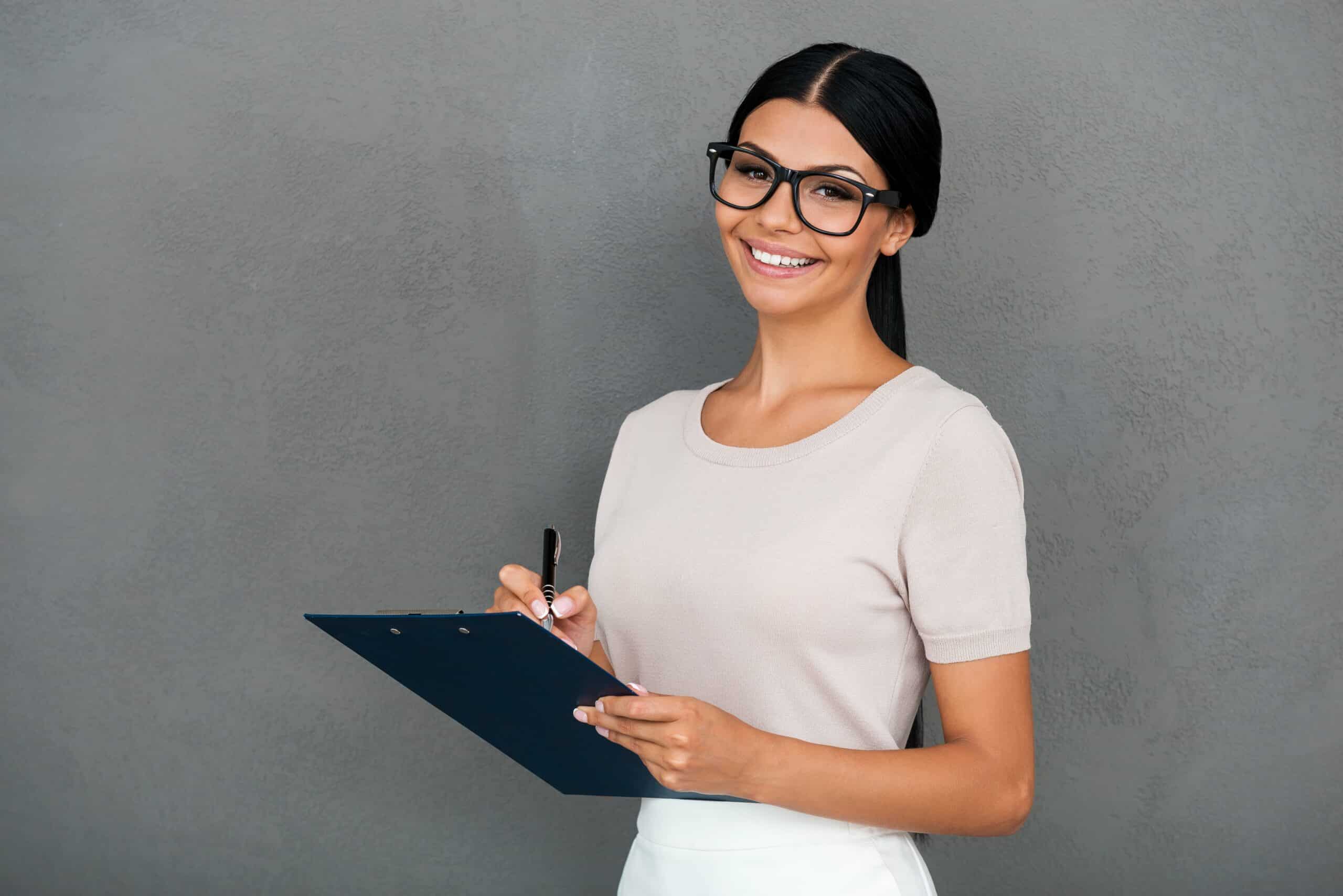 CQC care home inspection – professional woman holding a clipboard for assessment