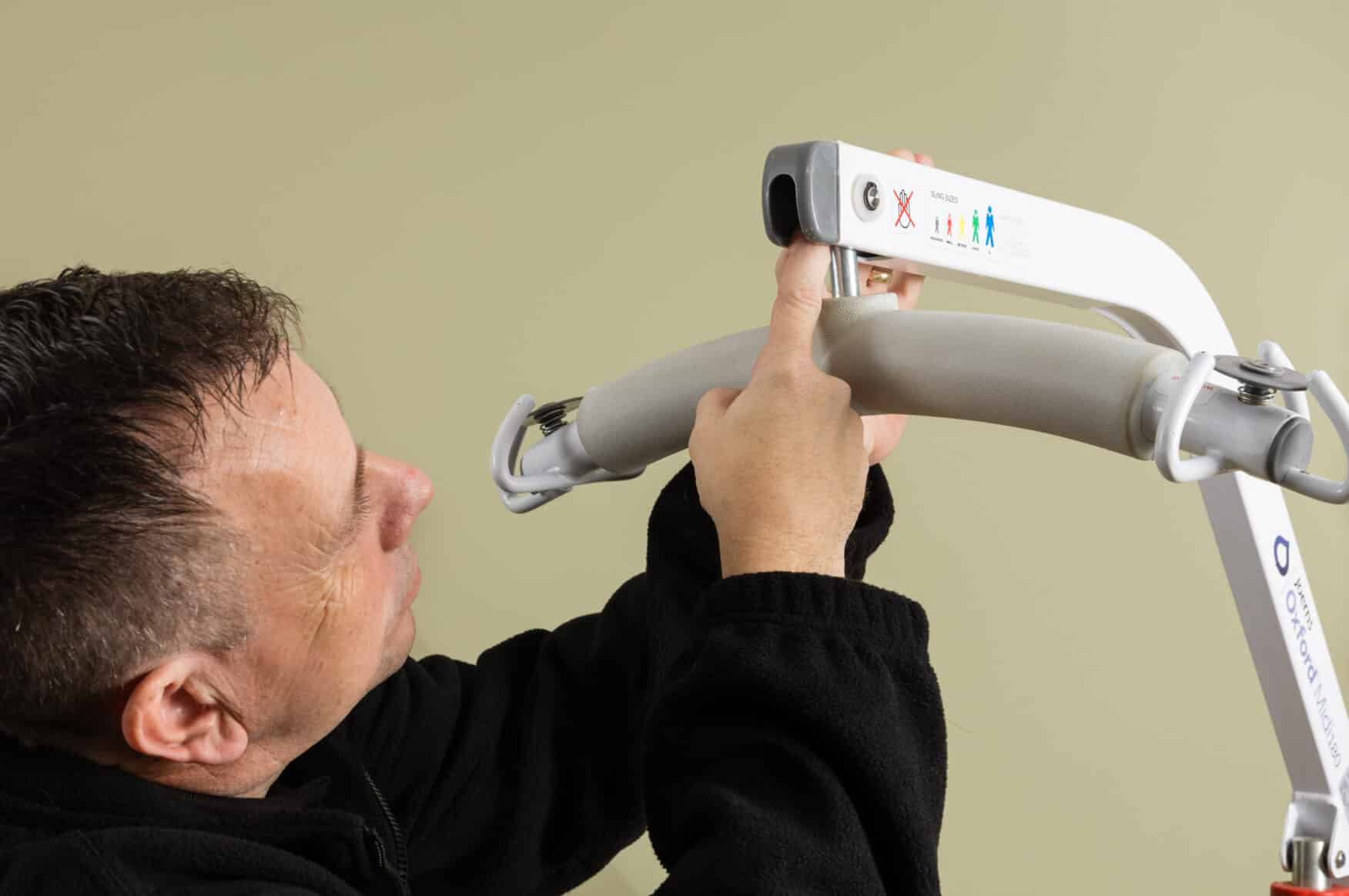 Engineer completing a LOLER hoist inspection as part of a care home compliance checklist.