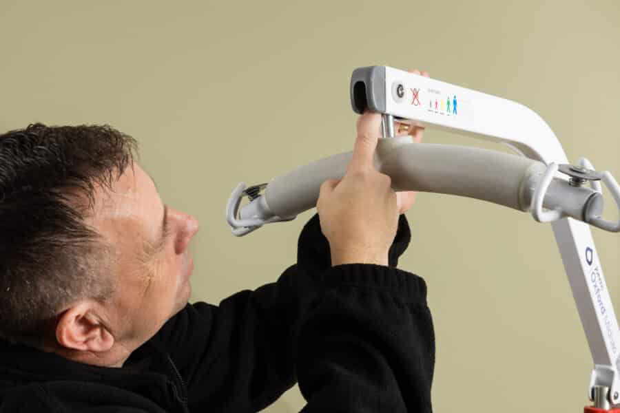 Engineer completing a LOLER hoist inspection as part of a care home compliance checklist.