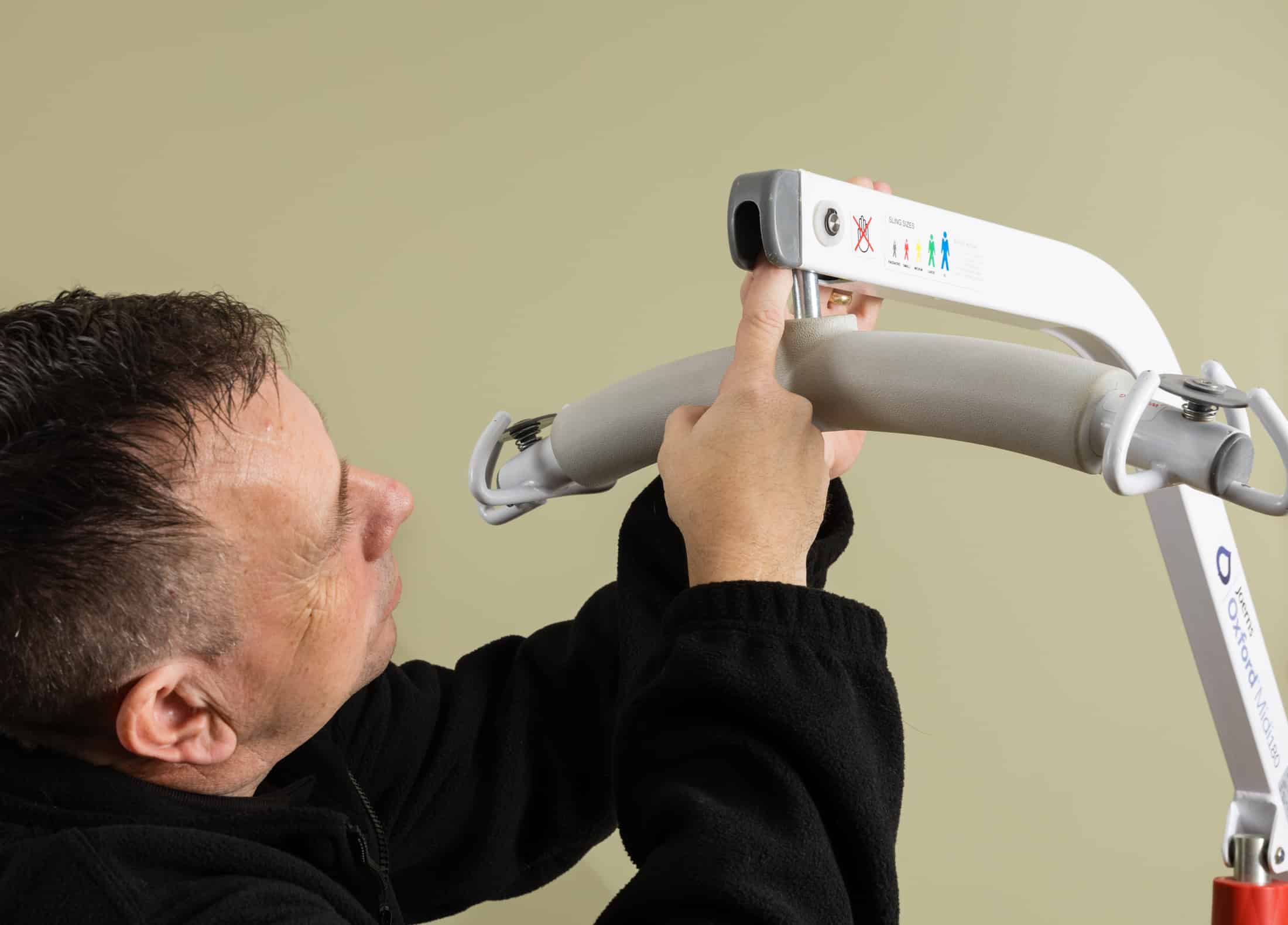 Engineer completing a LOLER hoist inspection as part of a care home compliance checklist.