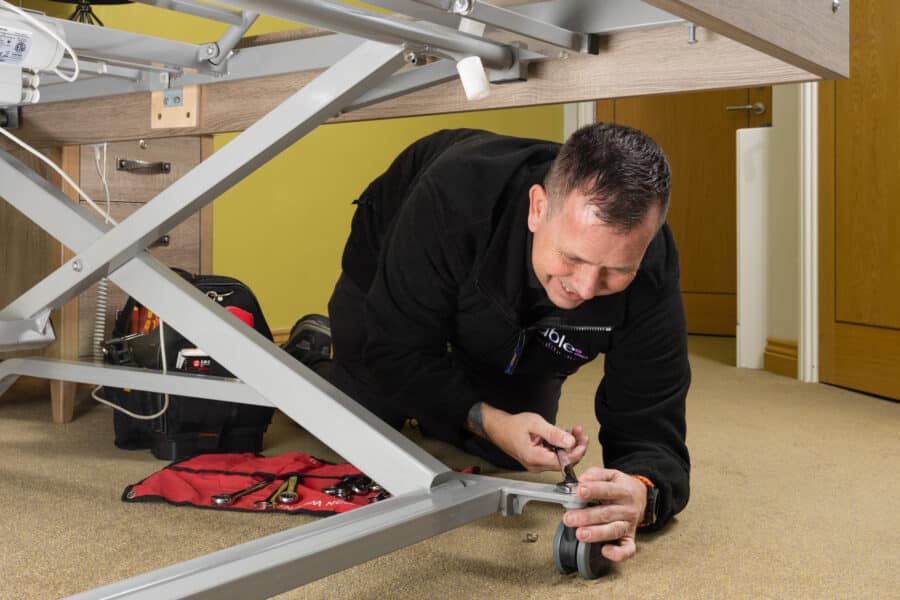 Care home bed equipment being checked to meet LOLER responsibilities for care home managers